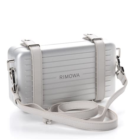 christian dior rimowa clutch